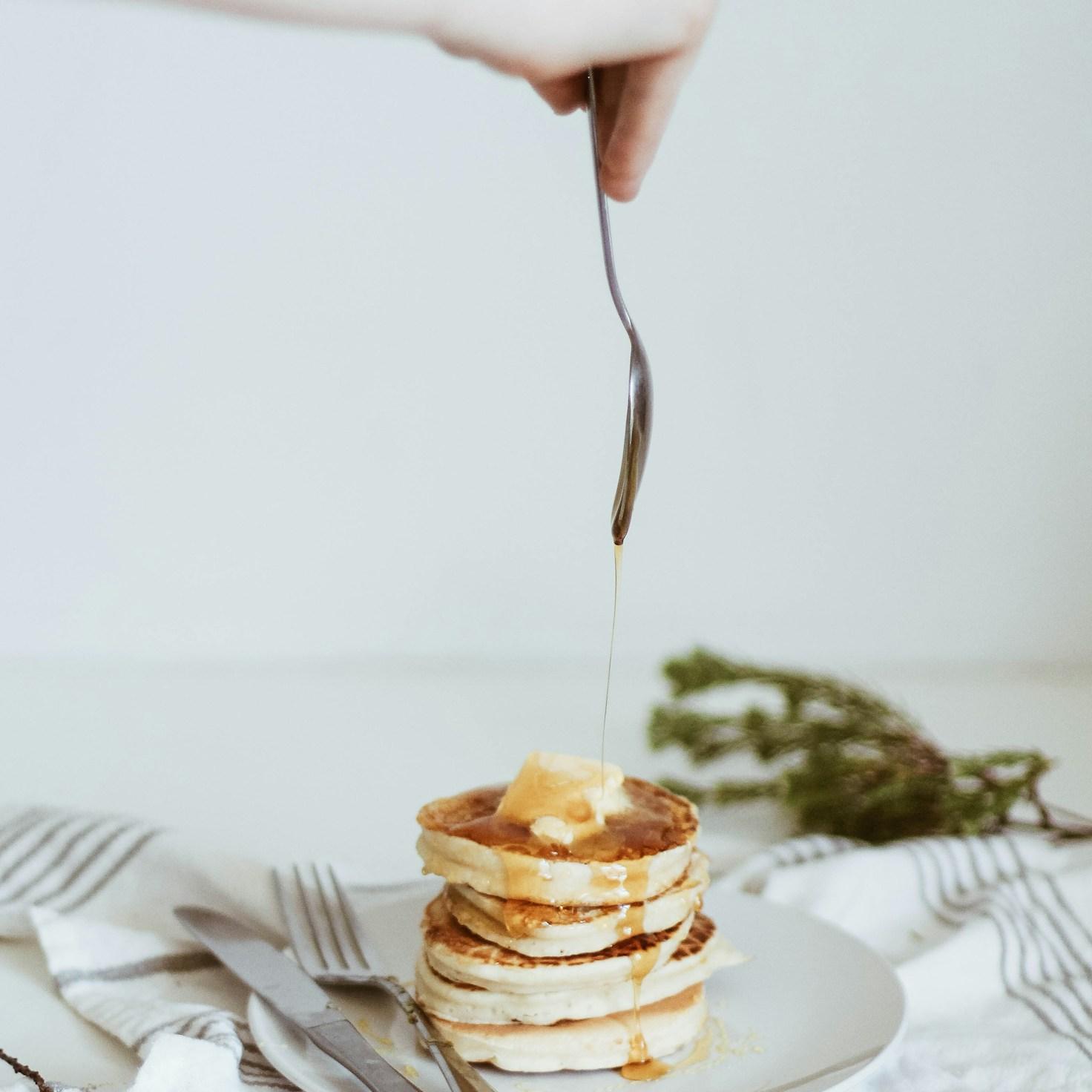 Community members collaborating in a modern kitchen space, sharing recipes and cooking techniques